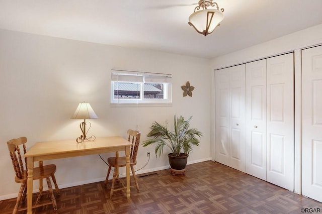 office featuring dark parquet flooring