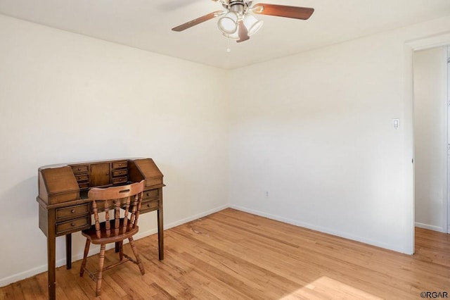 office space featuring ceiling fan and light wood-type flooring