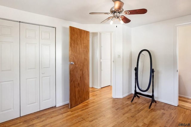 bedroom featuring a closet, ceiling fan, and light wood-type flooring