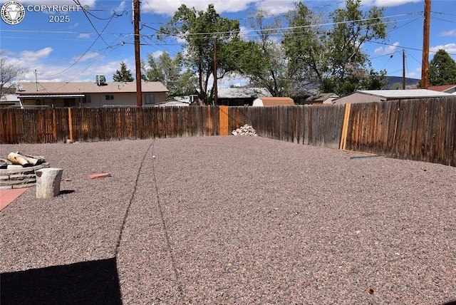 view of yard featuring a fenced backyard