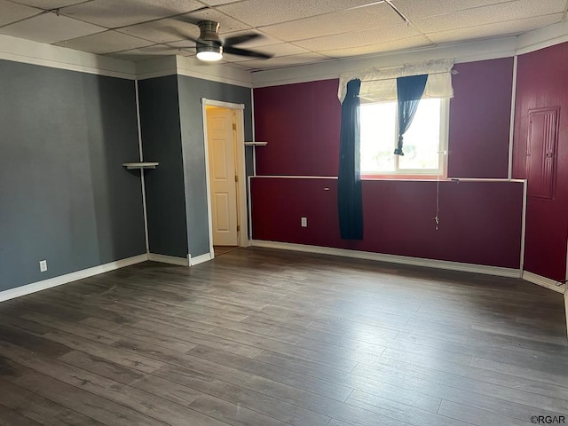 spare room with hardwood / wood-style flooring, a paneled ceiling, and ceiling fan