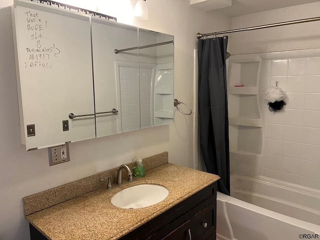 bathroom featuring vanity and shower / bath combination with curtain