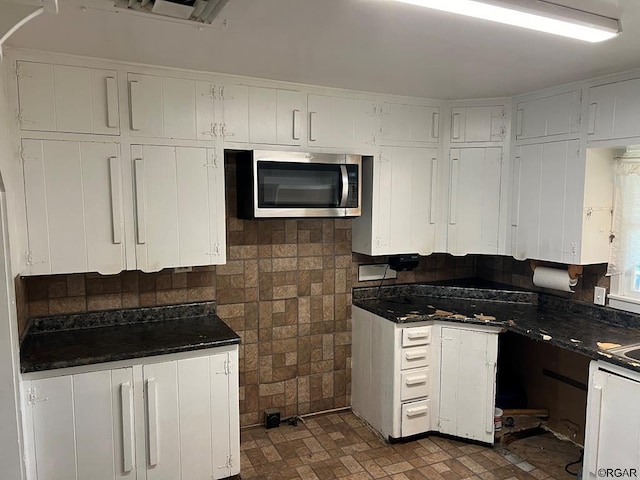 kitchen featuring white cabinets