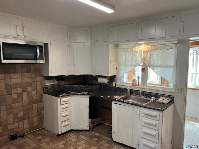 kitchen with sink and white cabinets