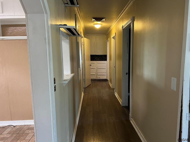 corridor featuring crown molding and dark hardwood / wood-style flooring