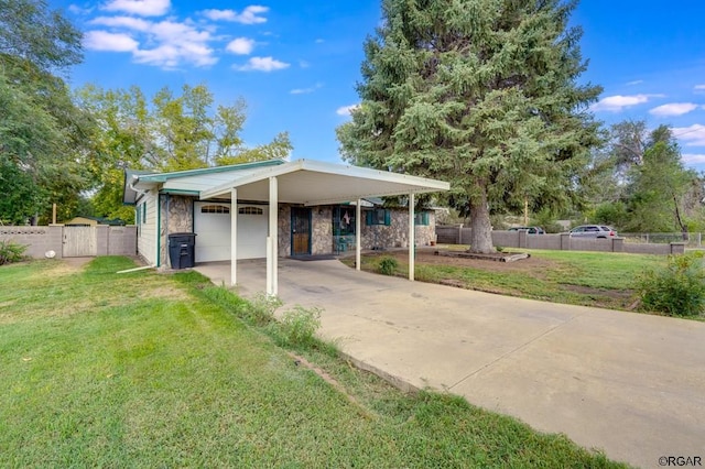 view of front of house with a carport, a garage, and a front lawn