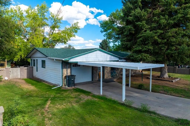 exterior space with a garage and a front lawn