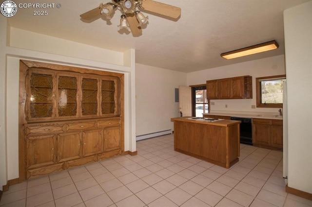 2324 W Willamette Ave, Colorado Springs, CO 80904 - kitchen with brown cabinetry, black dishwasher, a ceiling fan, a kitchen island, and a baseboard heating unit