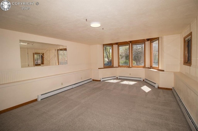 2324 W Willamette Ave, Colorado Springs, CO 80904 - unfurnished room with carpet floors, a baseboard radiator, and a textured ceiling