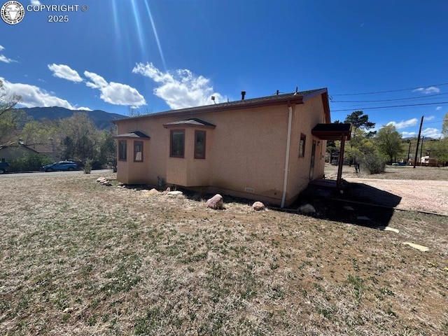 2324 W Willamette Ave, Colorado Springs, CO 80904 - view of home's exterior with a mountain view and stucco siding