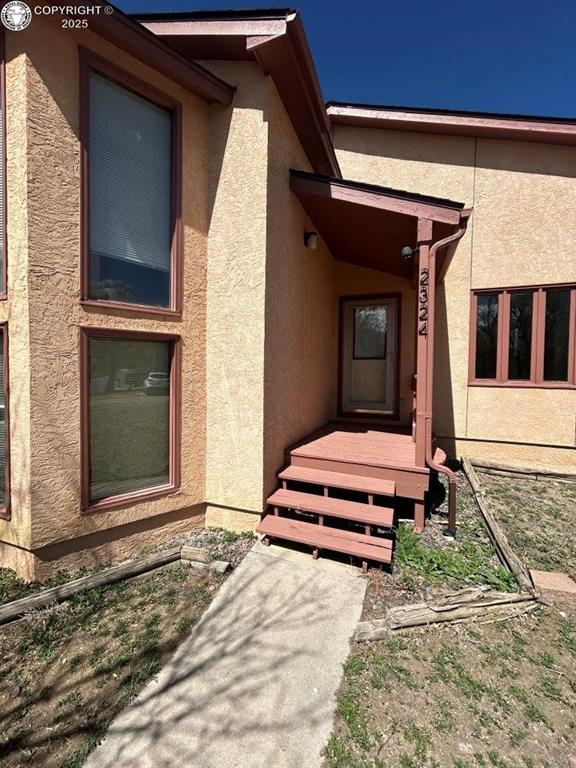 2324 W Willamette Ave, Colorado Springs, CO 80904 - doorway to property featuring stucco siding