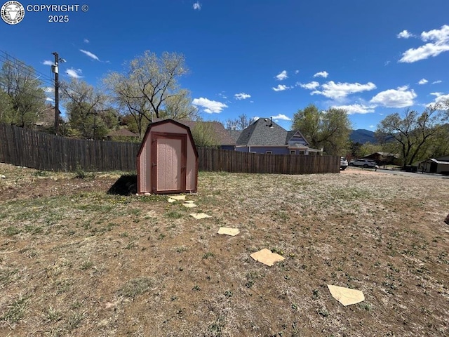 2324 W Willamette Ave, Colorado Springs, CO 80904 - view of yard featuring a storage shed, fence, and an outdoor structure