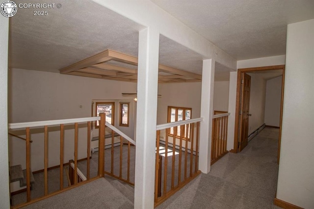 2324 W Willamette Ave, Colorado Springs, CO 80904 - corridor with baseboard heating, carpet floors, a textured ceiling, an upstairs landing, and beamed ceiling