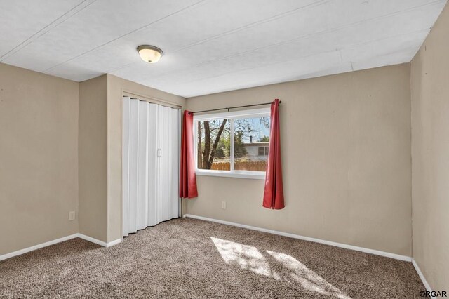 unfurnished bedroom with carpet floors