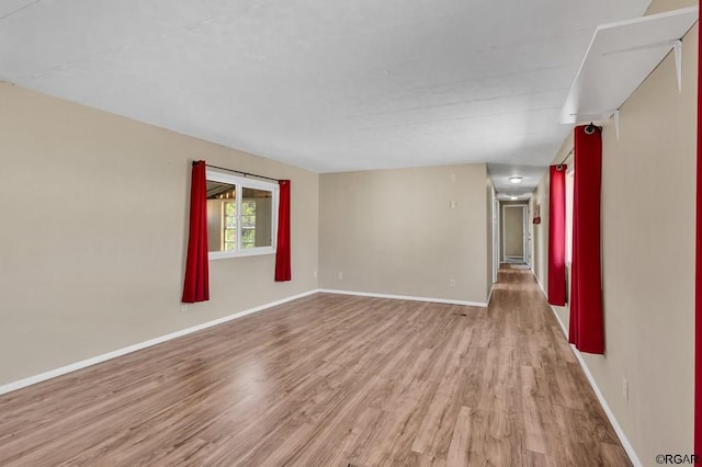 spare room featuring light hardwood / wood-style flooring