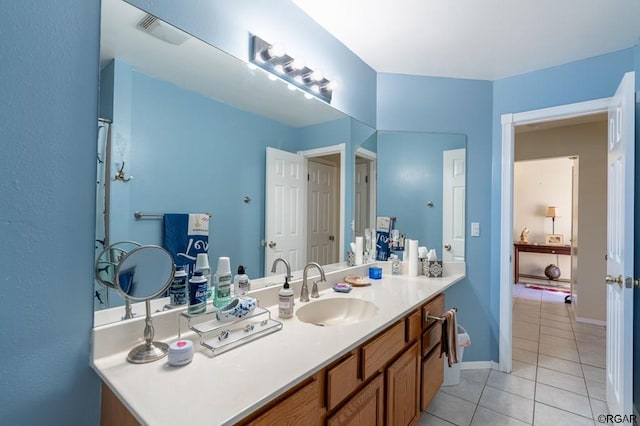 bathroom featuring tile patterned flooring and vanity