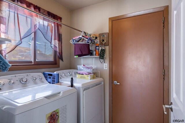 washroom with independent washer and dryer