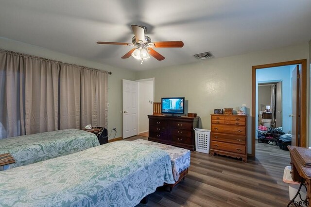 bedroom featuring dark hardwood / wood-style floors and ceiling fan