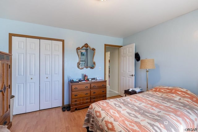 bedroom featuring light hardwood / wood-style flooring and a closet