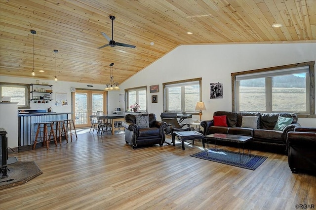 living room featuring hardwood / wood-style flooring, ceiling fan, high vaulted ceiling, and wooden ceiling