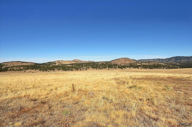 view of mountain feature featuring a rural view