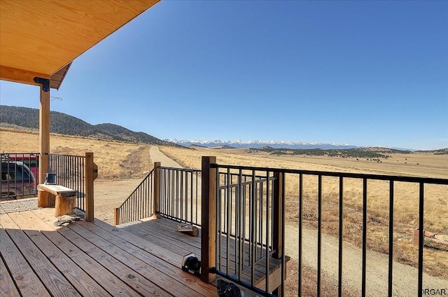 wooden terrace with a mountain view and a rural view