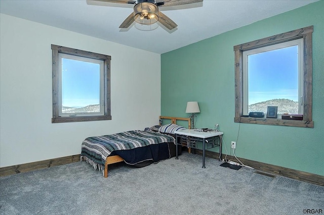 bedroom with ceiling fan and carpet