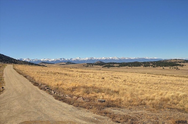 view of mountain feature with a rural view