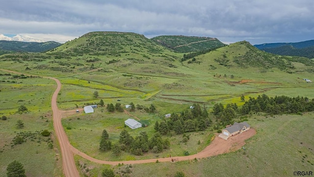 bird's eye view featuring a rural view and a mountain view