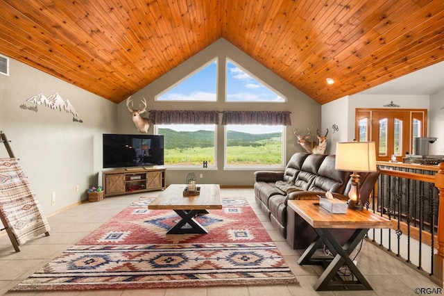 tiled living room featuring wood ceiling and high vaulted ceiling