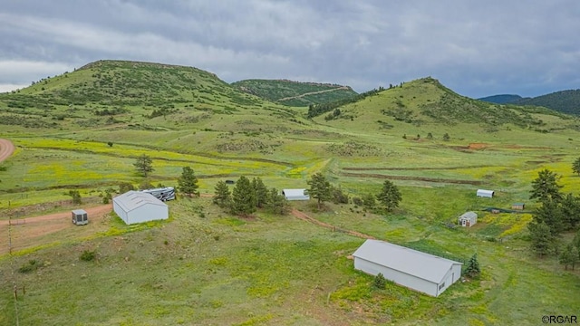 mountain view featuring a rural view