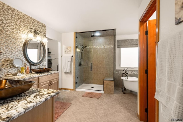 bathroom featuring vanity, tile patterned floors, and plus walk in shower