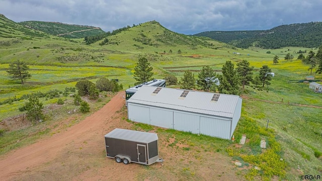 bird's eye view with a mountain view and a rural view