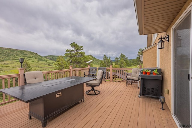 wooden deck featuring a mountain view