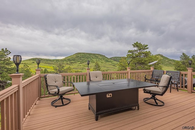 wooden terrace with a mountain view