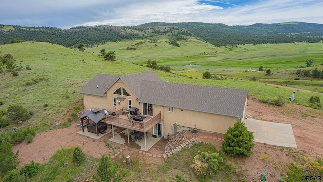 drone / aerial view featuring a rural view and a mountain view