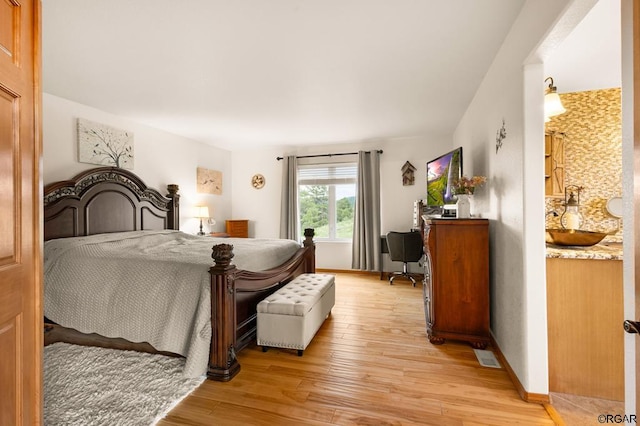 bedroom with light hardwood / wood-style flooring