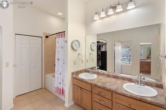 bathroom with shower / bath combination with curtain, tile patterned floors, and vanity