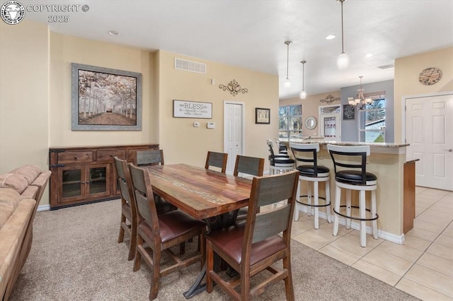 dining space with light tile patterned floors