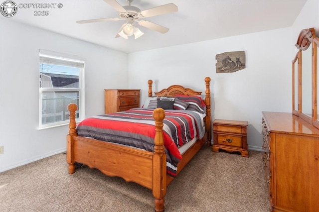 bedroom with ceiling fan, carpet floors, and multiple windows