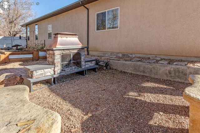 rear view of house with a fireplace