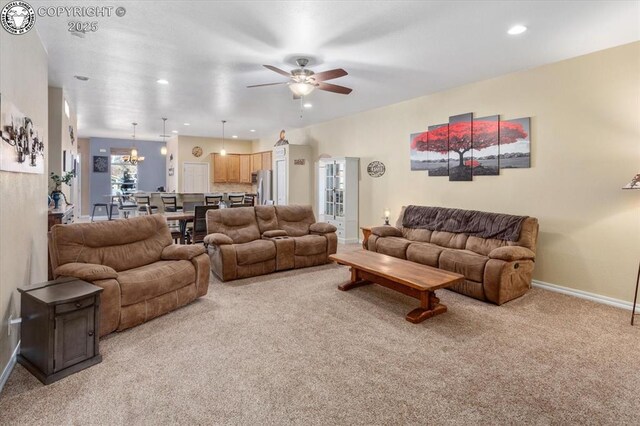 carpeted living room featuring ceiling fan