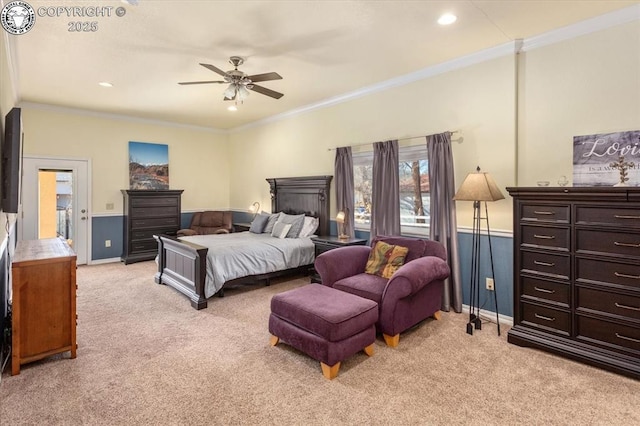 carpeted bedroom featuring crown molding and ceiling fan