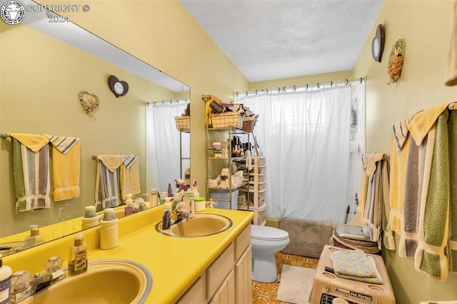 full bathroom with shower / bathtub combination with curtain, vanity, and toilet