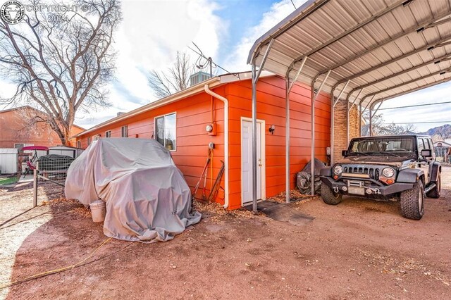 view of outbuilding featuring a carport