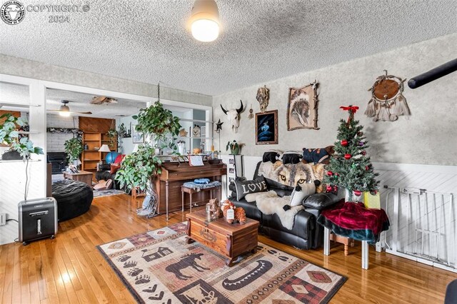 living room featuring hardwood / wood-style flooring and a textured ceiling