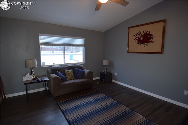 living room with lofted ceiling, dark wood-type flooring, and ceiling fan