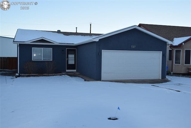 single story home featuring a garage