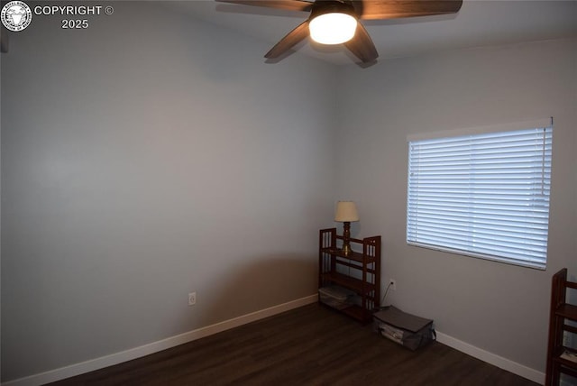 unfurnished room with dark hardwood / wood-style floors and ceiling fan