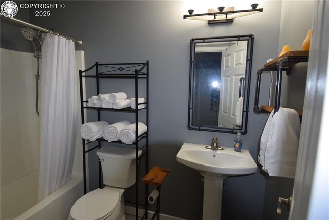 full bathroom with shower / bath combination with curtain, toilet, and sink